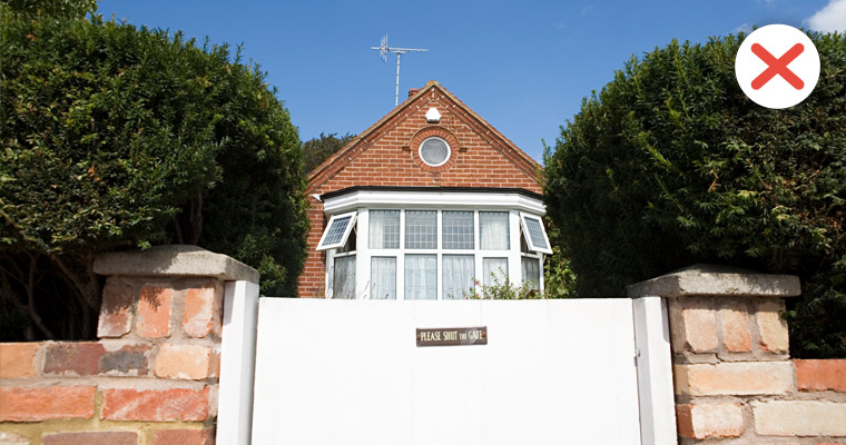 A gate in front of a house