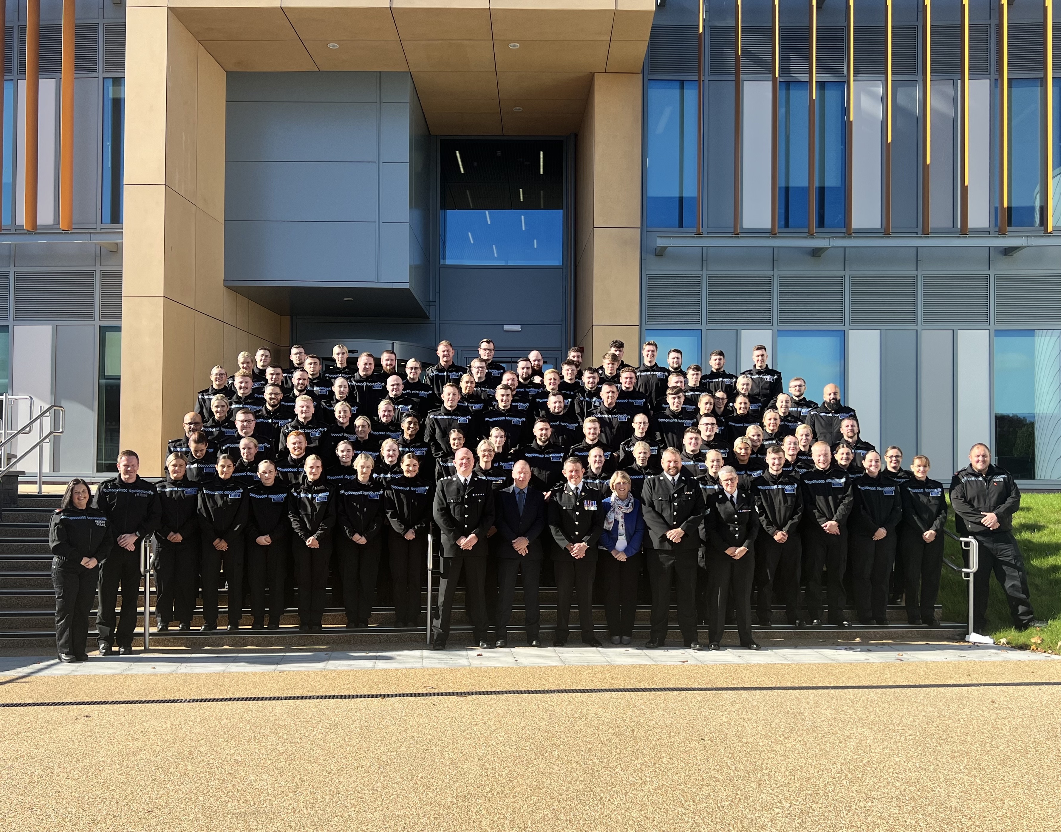 Image of group of officers outside a building 