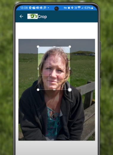Mobile phone screen showing an image of a woman